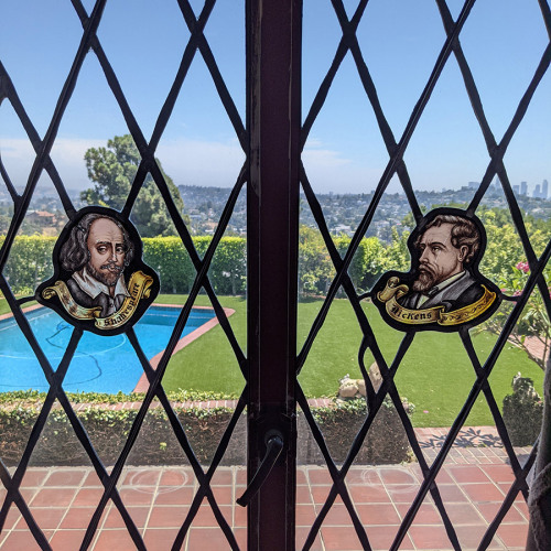 Shakespeare (left) and Dickens (right) on the window view of Walt Disney’s garden. (2020)